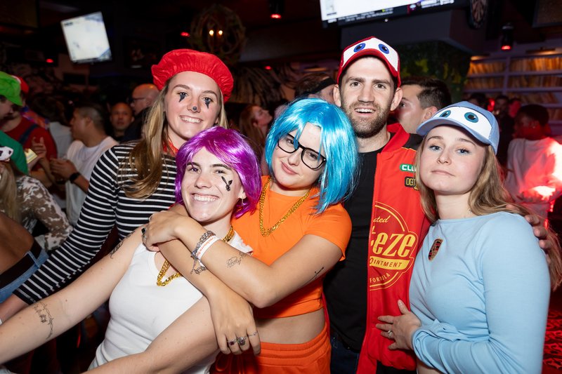A large costumed group crowded together for a photo at Crawlloween 2025